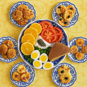 Cultural pastry excellence displayed in a lavish Arabic breakfast spread featuring soup, dates, and savory pastries on blue-decorated plates.